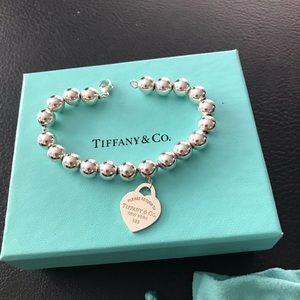TIFFANY ball bracelet. NEVER WORN. COMES WITH POUCH AND ORIGINAL BOX.